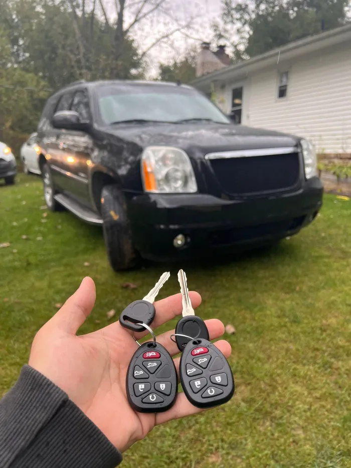 Two remote head keys for a black GMC Yukon