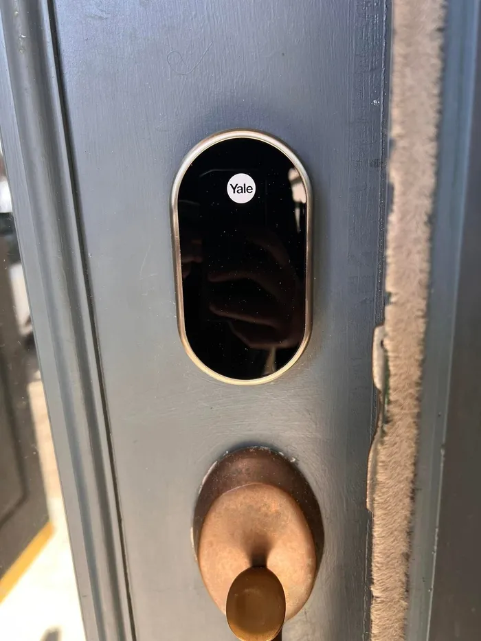 Yale touchscreen smart lock installed on a steel door