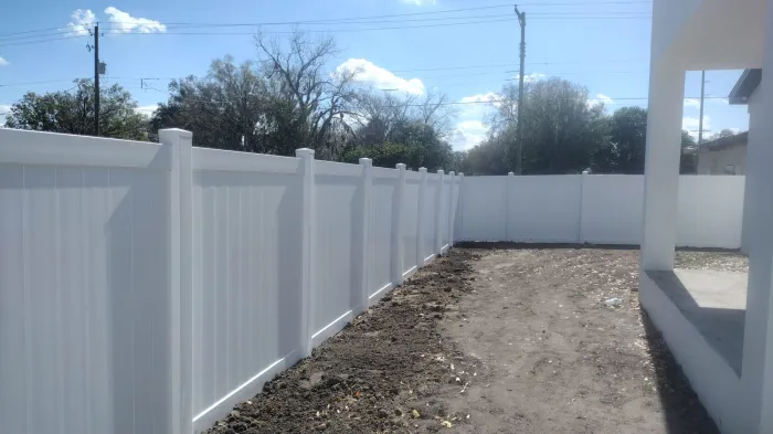 White vinyl backyard fence