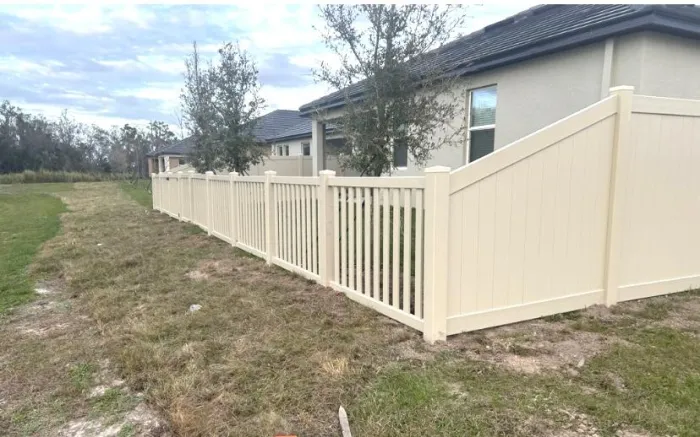 Tan vinyl semi-privacy fence
