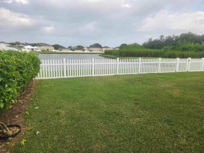 White vinyl picket fence
