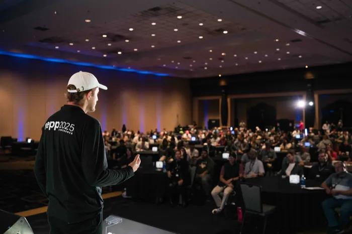 Eli speaking on stage