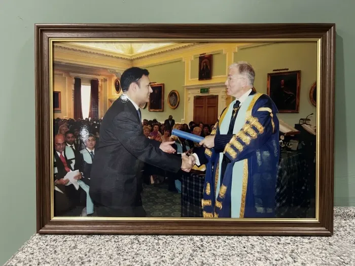 Dr Abbas in academic dress at his graduation