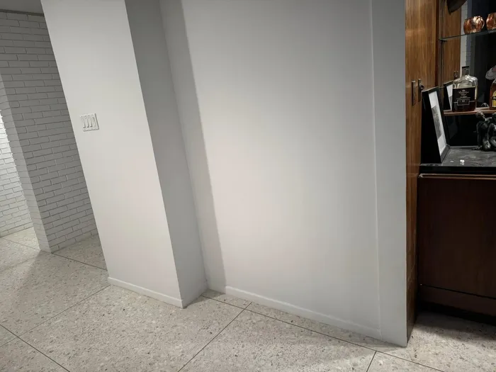 Smooth white walls meeting at a clean corner