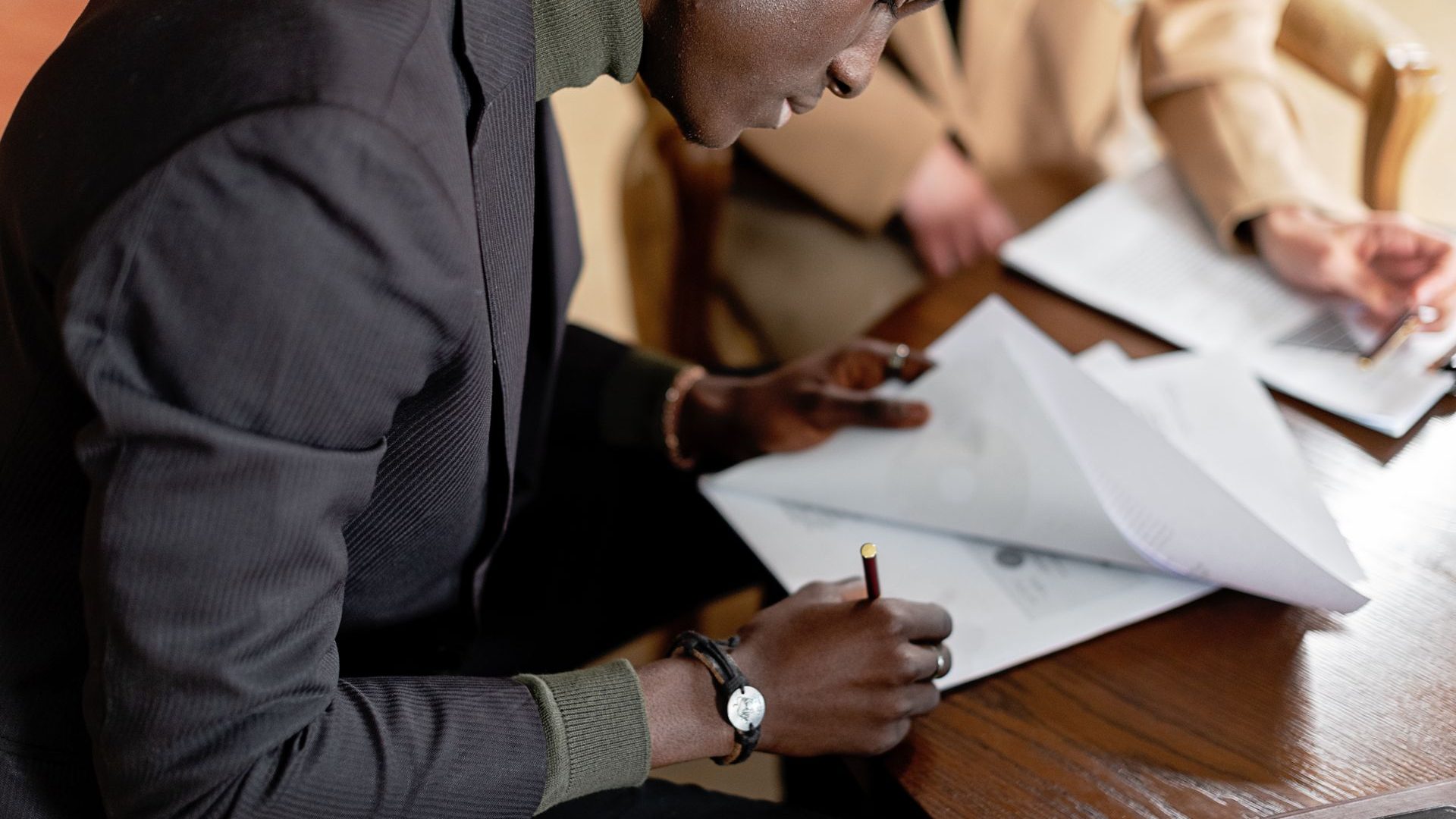 Export documents being signed and checked at a desk — Mashamba's Ugandan export documentation and compliance guide