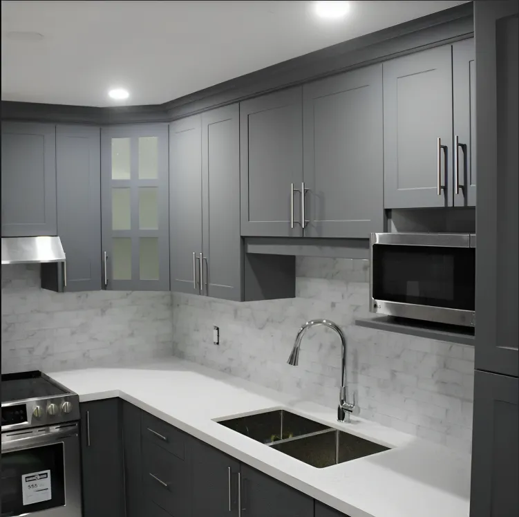 Grey shaker kitchen with white quartz counters and undermount sink
