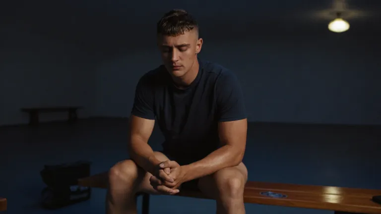Athlete alone in the dressing room, settling himself before competition
