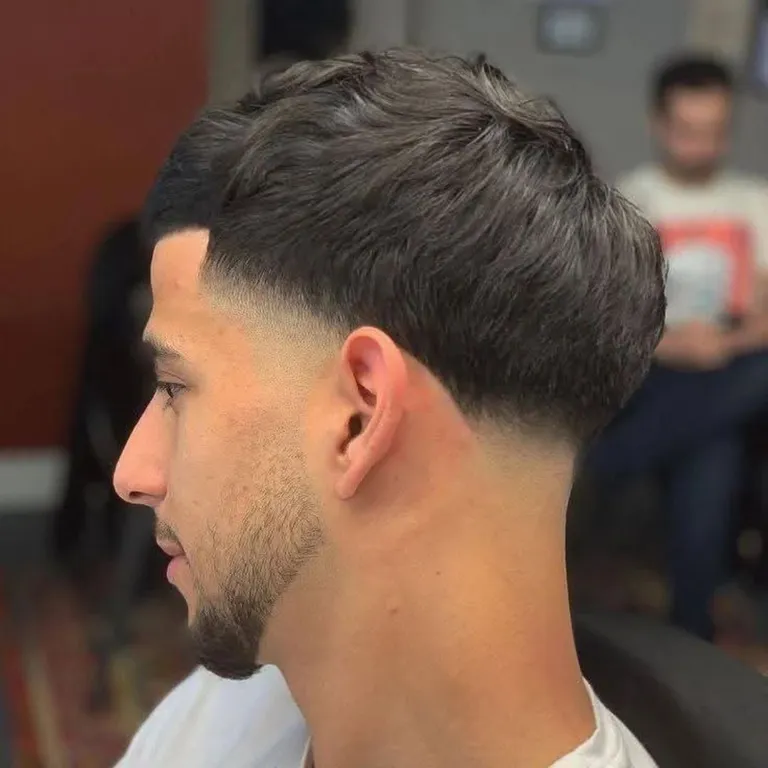 Textured crop with taper fade at Salon Salman