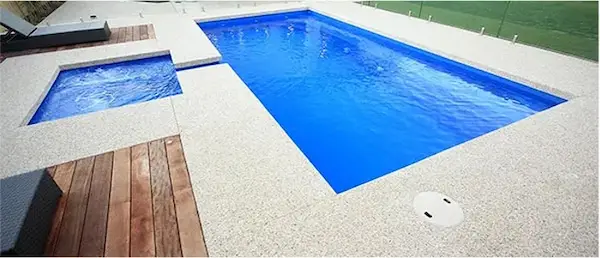Fibreglass swimming pool with bench seating