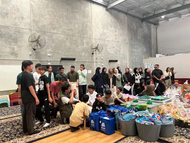 Volunteers sorting donations in the hall