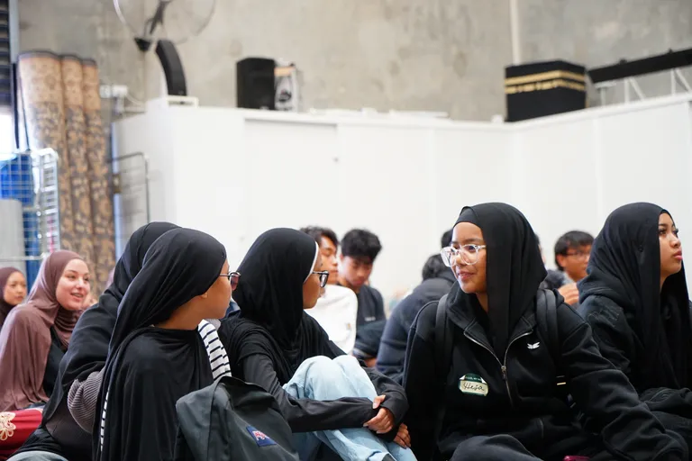Sisters listening during a youth session