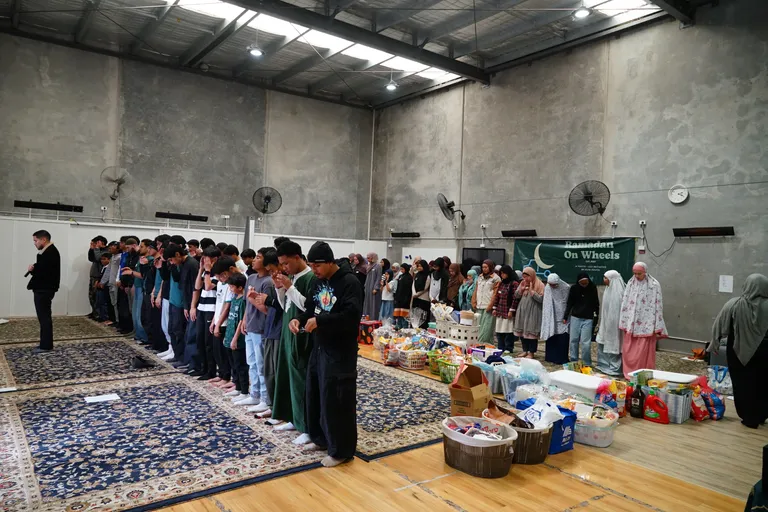 Volunteers lined up in the hall on packing day
