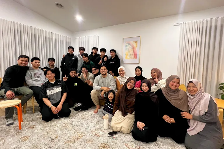 KUM Youth members gathered in a living room