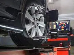 Service bay at Duluth Auto Service and Imports with a vehicle on the lift