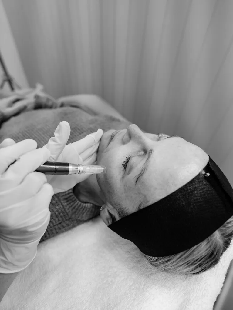 Nurse performing a skin treatment in clinic