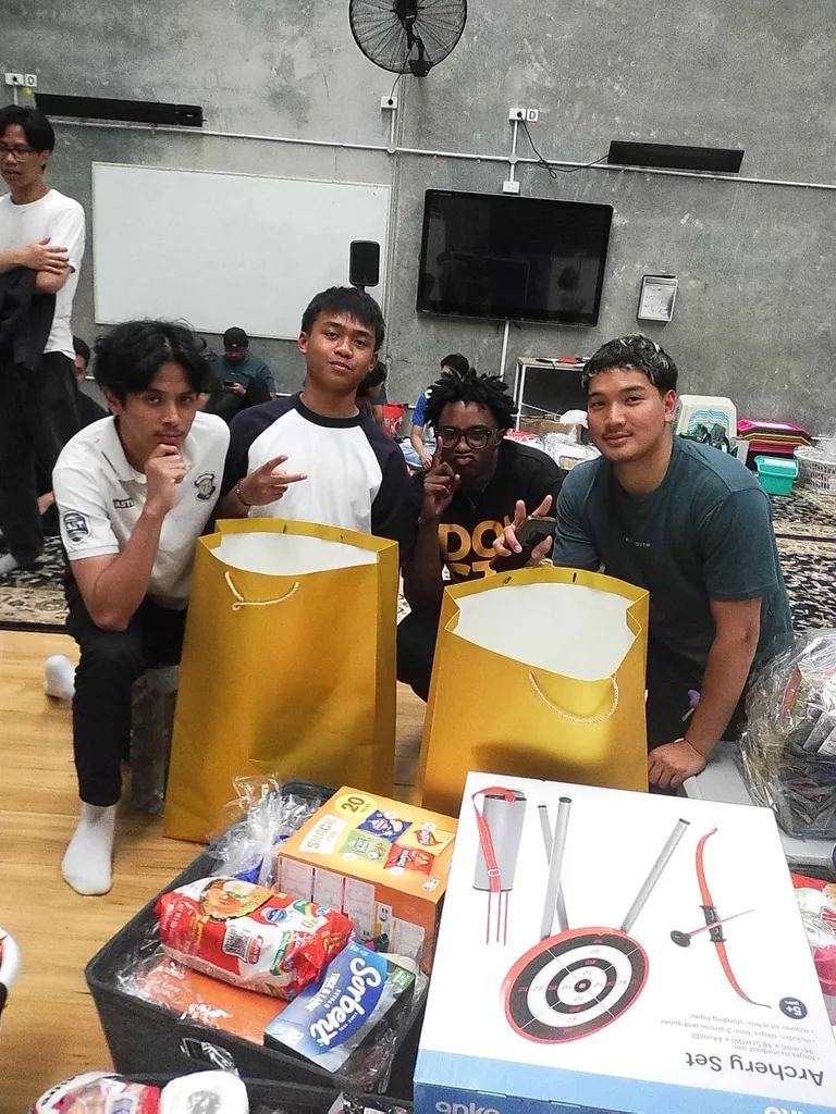 Brothers' team with packed gifts in the hall