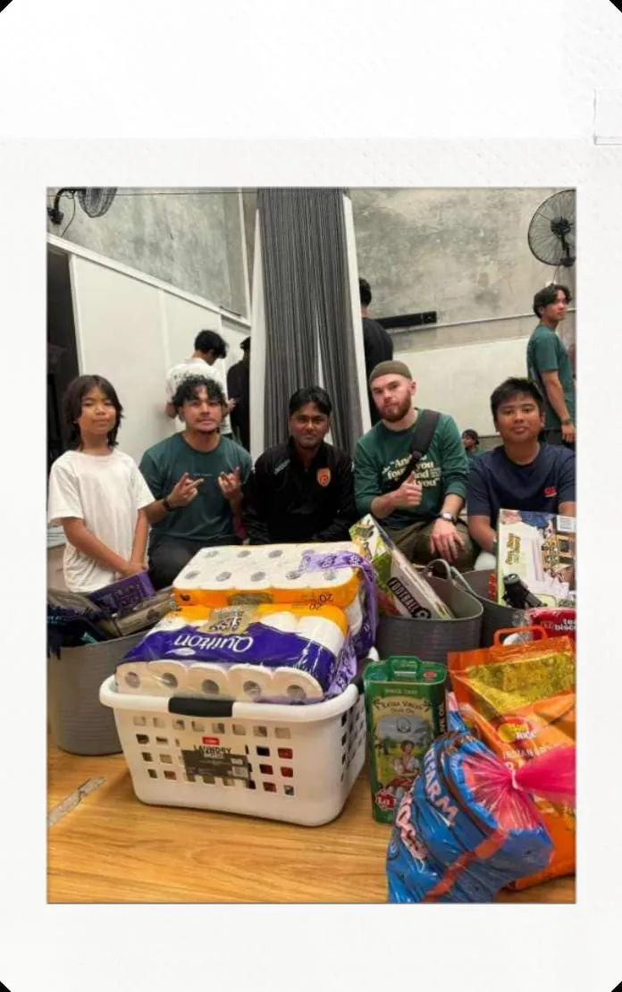 Volunteers with baskets of donated items