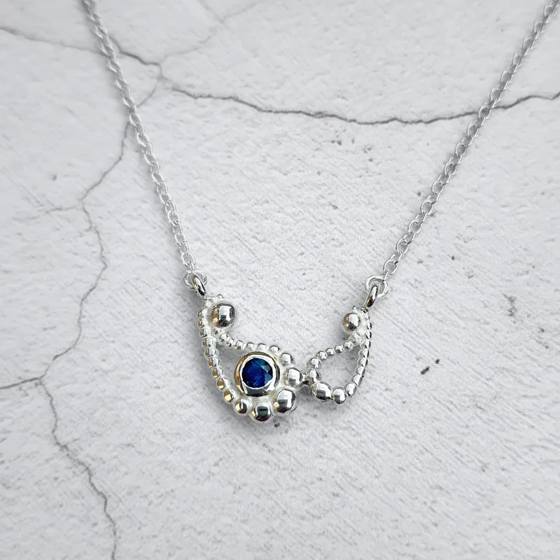Double Silver Paisley Pendant with Blue Topaz