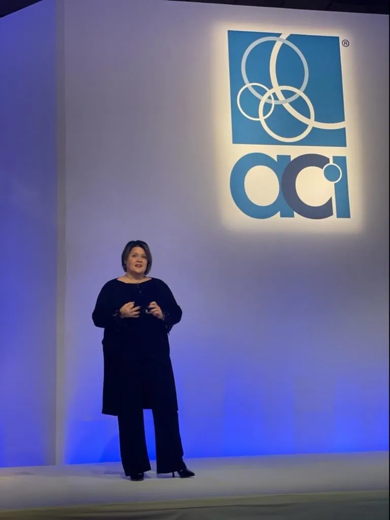Amy Riccardi speaking on the main stage at the American Cleaning Institute Annual Conference in Orlando, Florida
