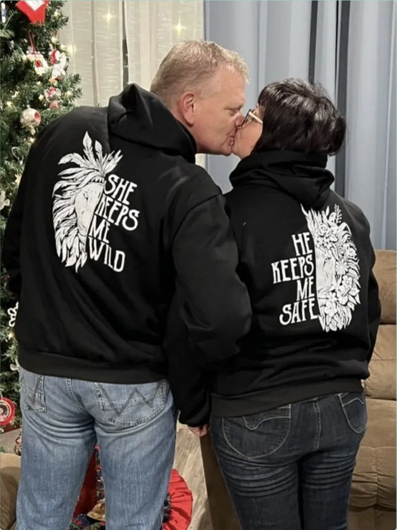 Shawn and Rosanne in matching hoodies that read She Keeps Me Wild and He Keeps Me Safe