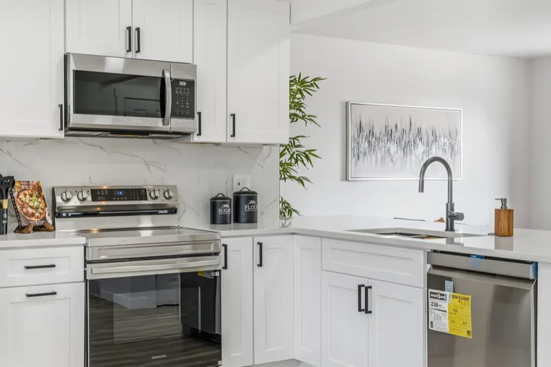 Modern white shaker kitchen remodel with quartz countertops