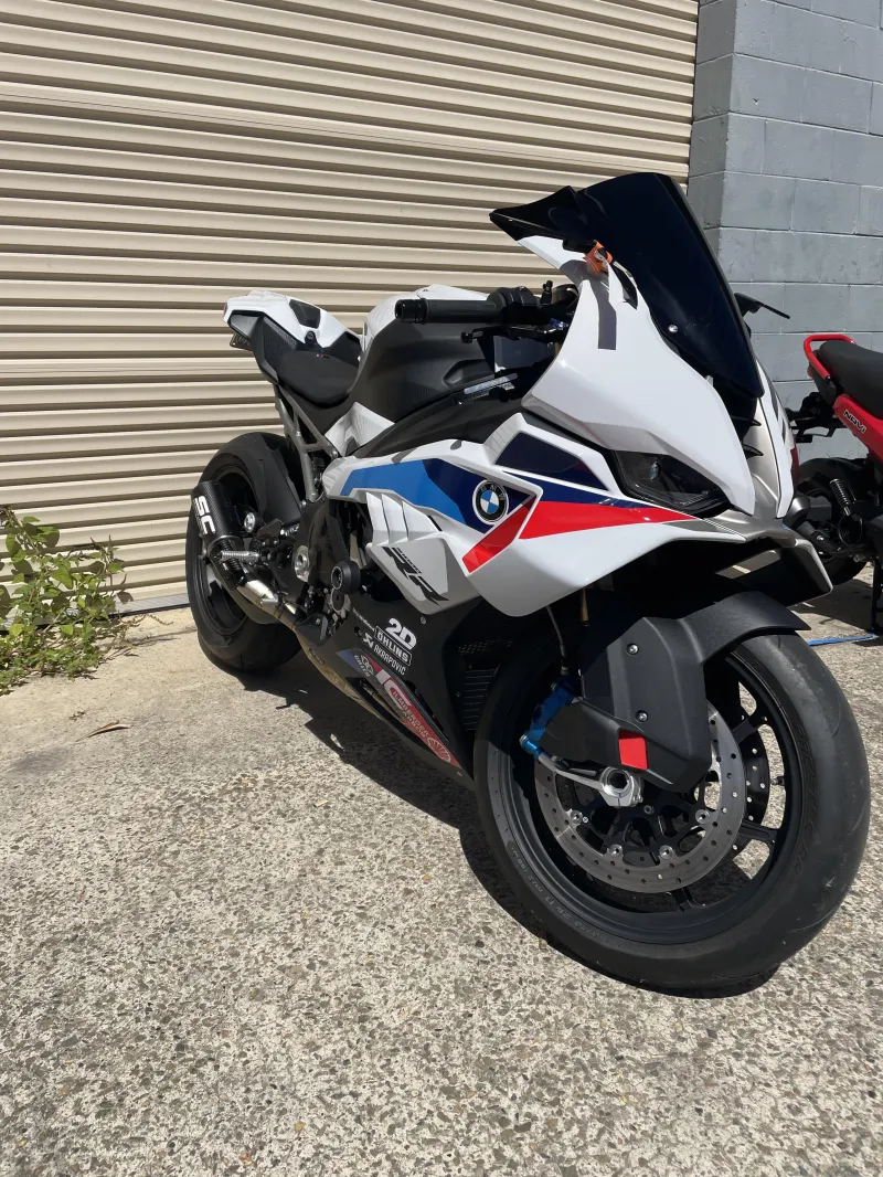 The S1000RR parked outside the workshop roller door