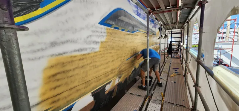 Hull sides longboarded through the guide coat
