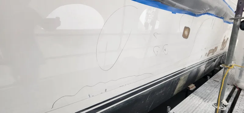 Cracks and damage mapped in marker across the hull side
