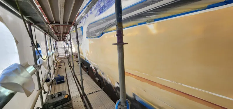 Full length of the hull sides faired and guide coated