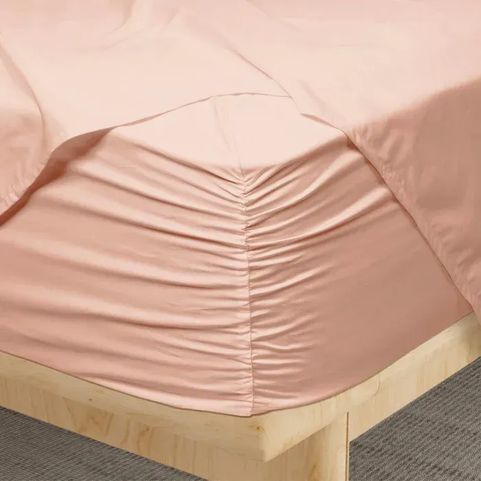PureCare Weightless Cotton Sheets in Blush Pink, styled