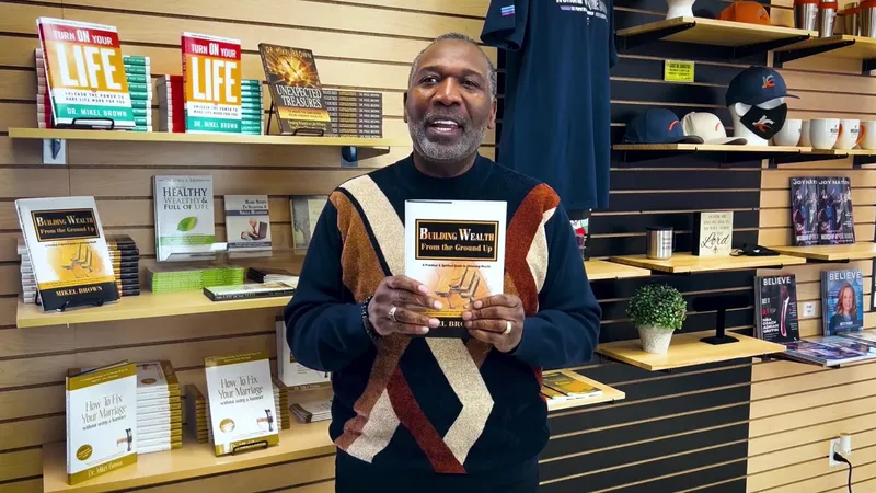 Dr. Brown holding one of his books in a bookstore