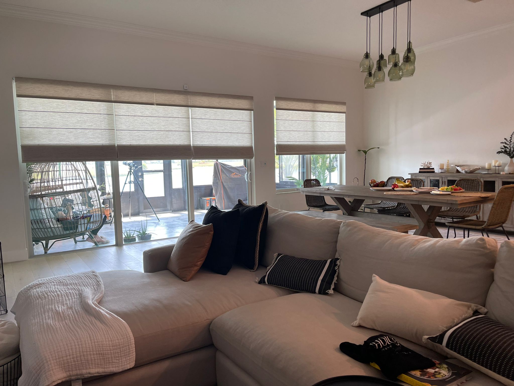 Zebra shades across a large open living and dining room