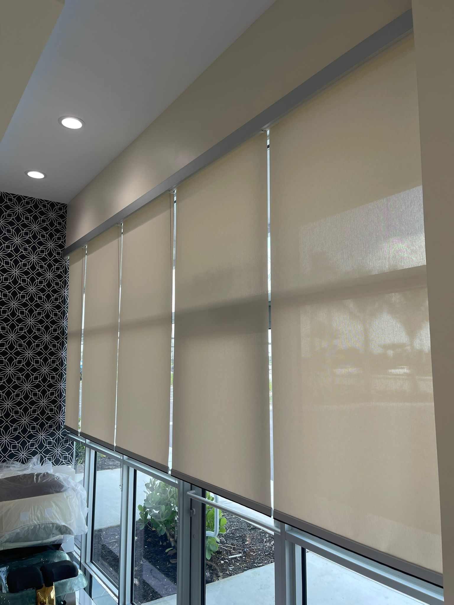 Floor-to-ceiling solar shades on tall great room windows