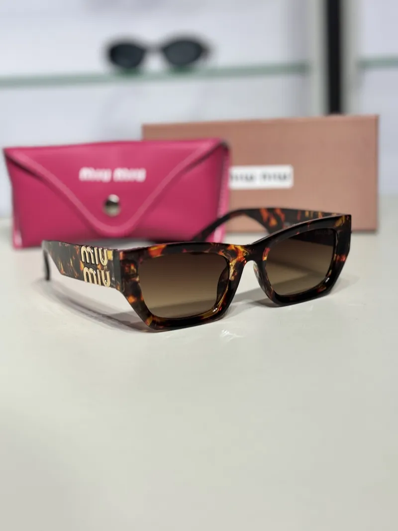 Miu Miu Sunglasses Brown 