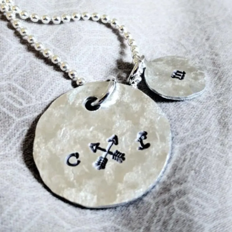 Crossed Arrows Initials