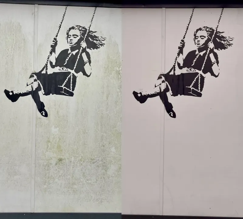 Mural wall cladding cleaned, before and after