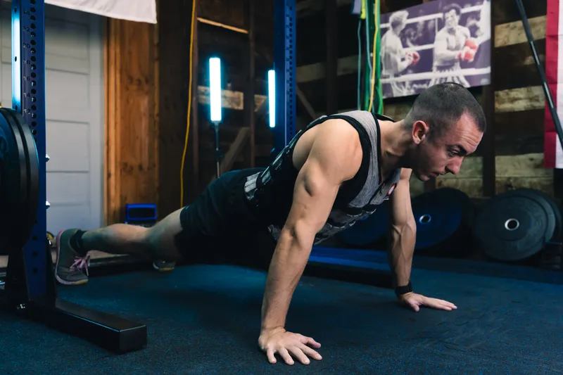 Jonathan doing a push-up on the gym floor