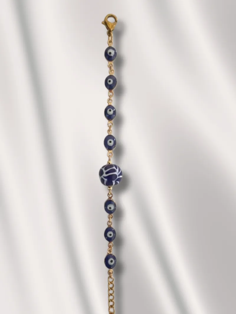 1033 - Pulsera dorada con ojos turcos en óvalo