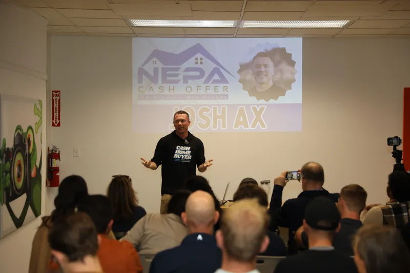 Josh Ax speaking at a local real estate event