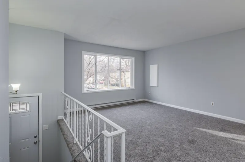 Living room after renovation, with new carpet