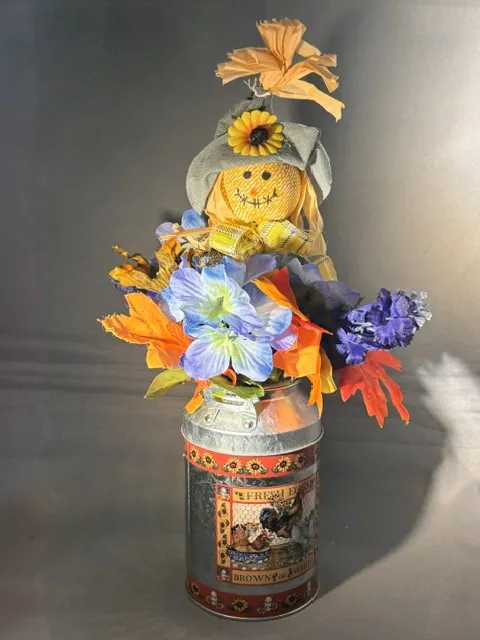 Small Artificial Foral Arrangement in Decorative Milk Tin w/ Scarecrow