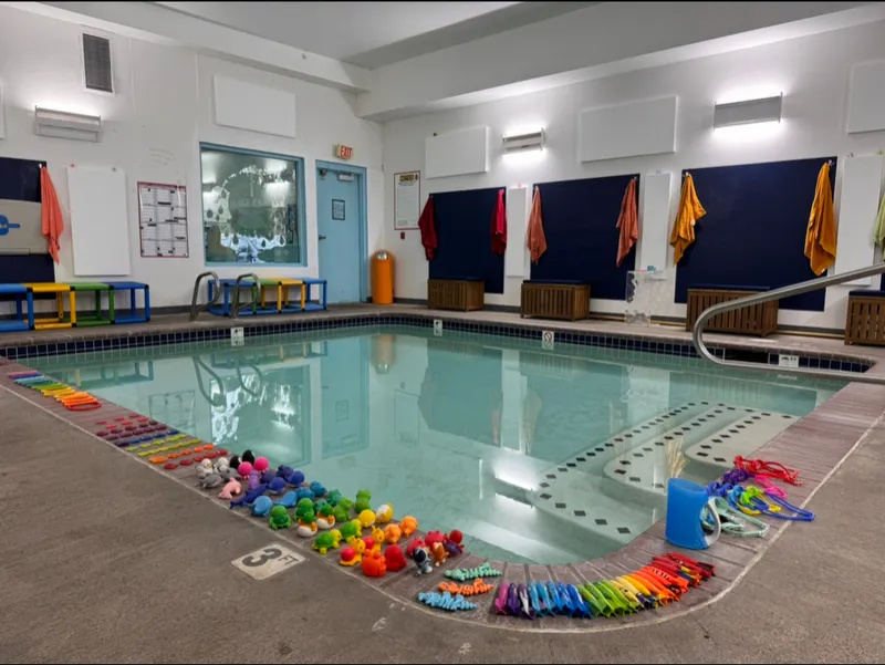 The Puddle: a small, bright indoor pool with steps into warm water