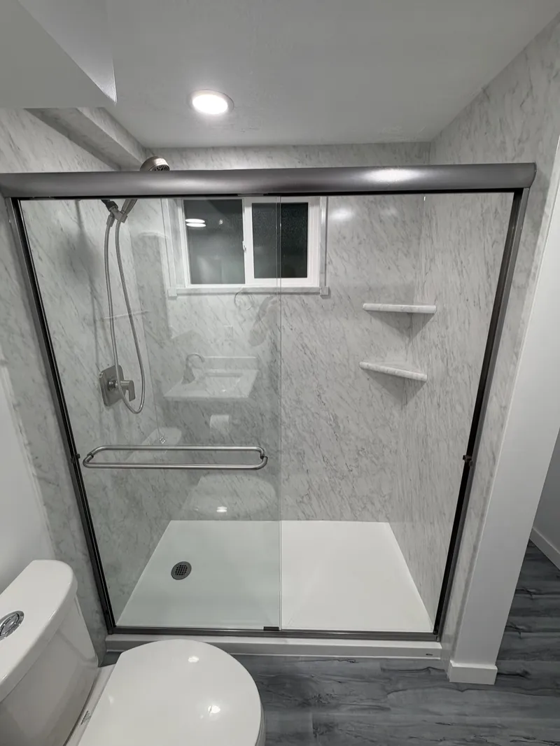 Walk-in shower with sliding glass doors