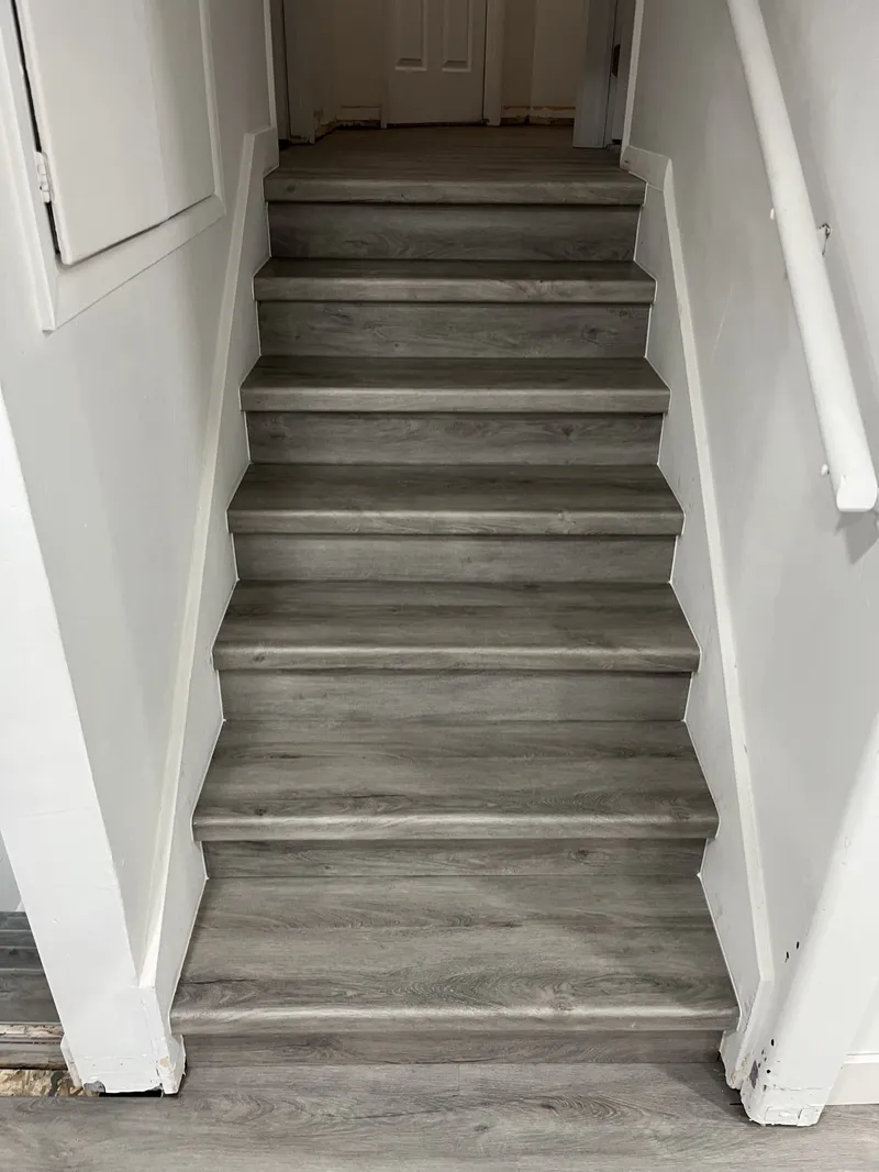 Staircase finished in gray plank flooring