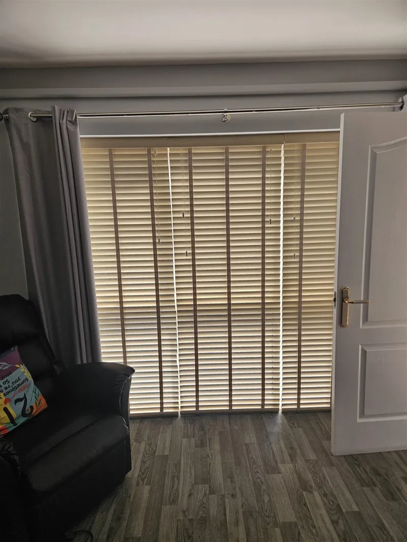 Wooden venetian blinds with tapes fitted on patio doors by Eclipse SBC in Retford