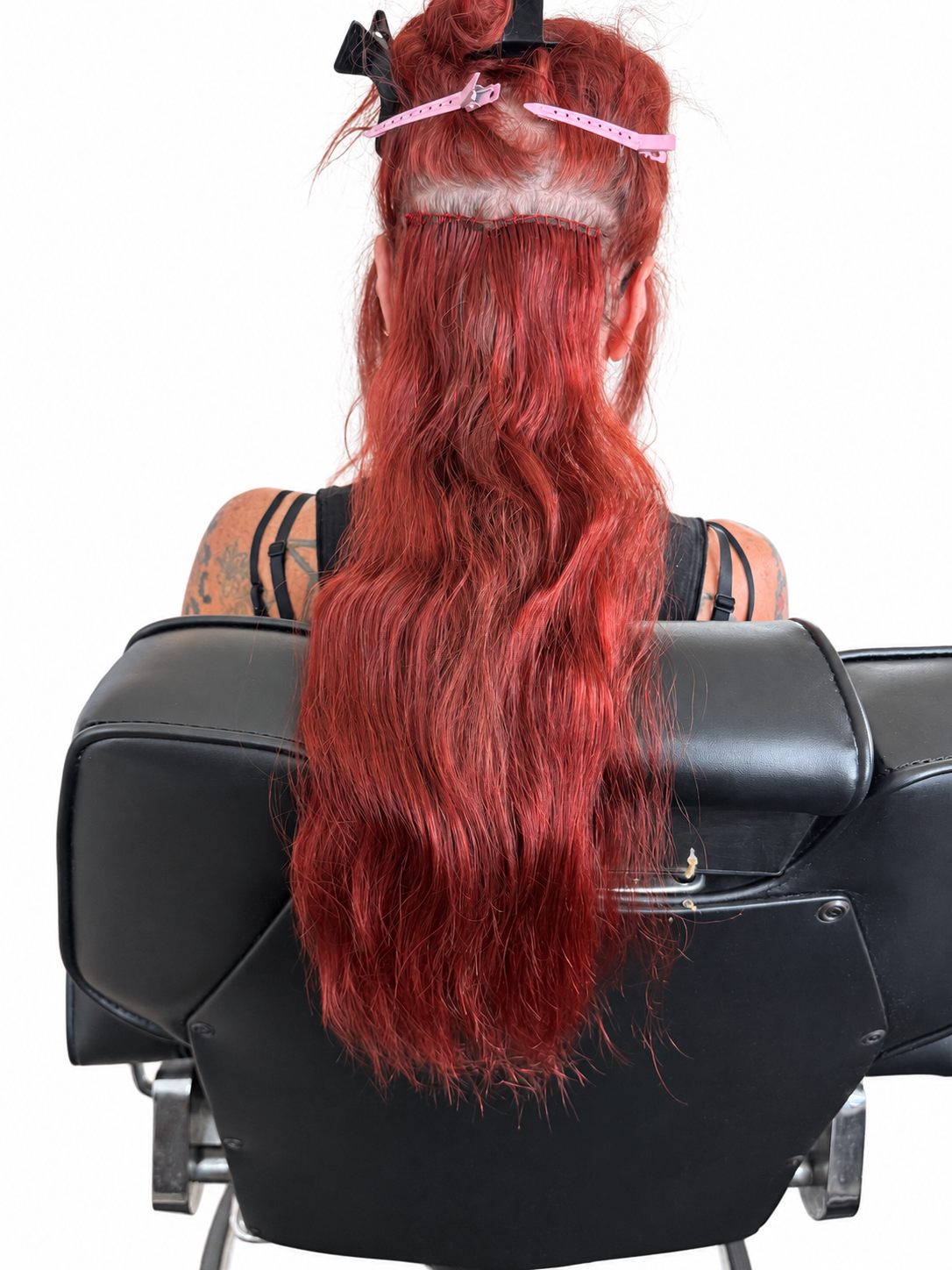 Red sew-in extensions per track