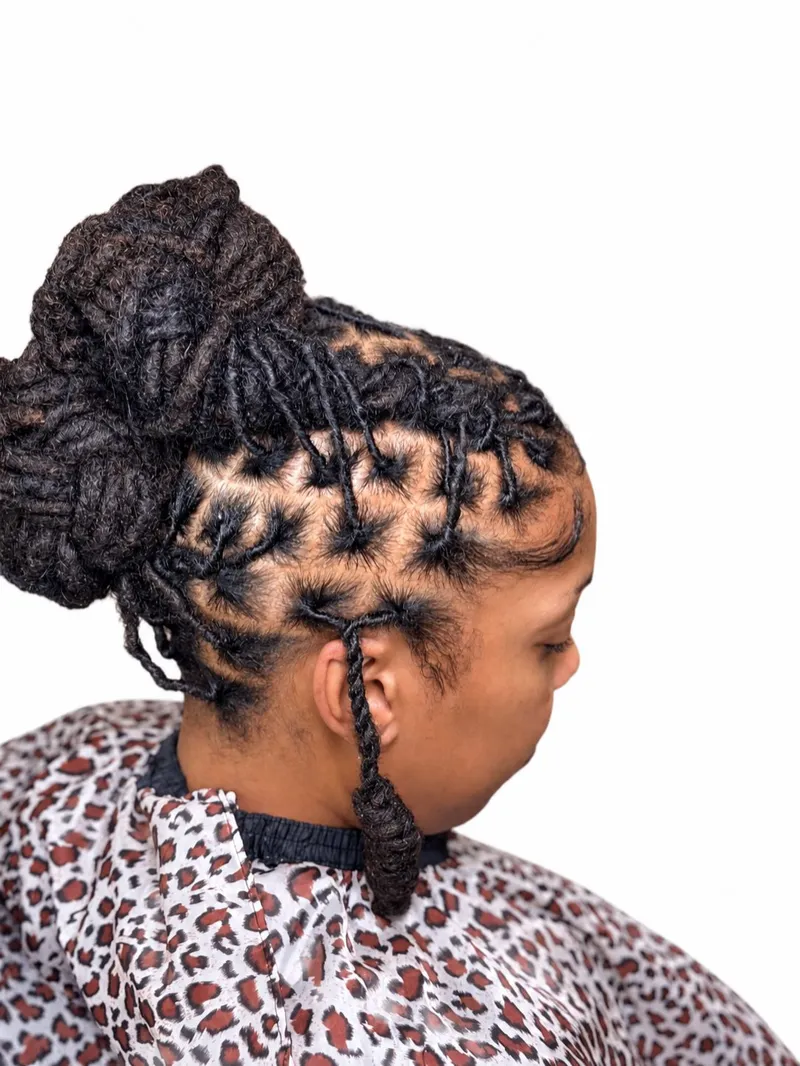Palm roll full-head loc bun, side view
