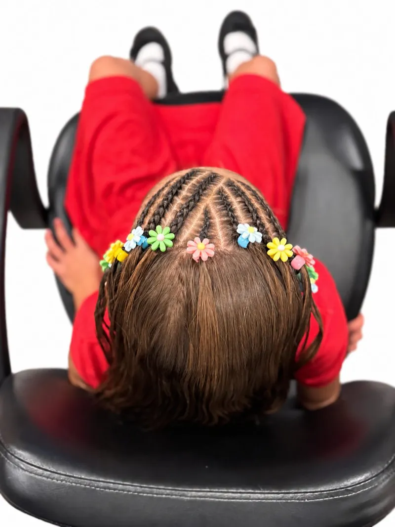 Braids with colorful flower clips, overhead view