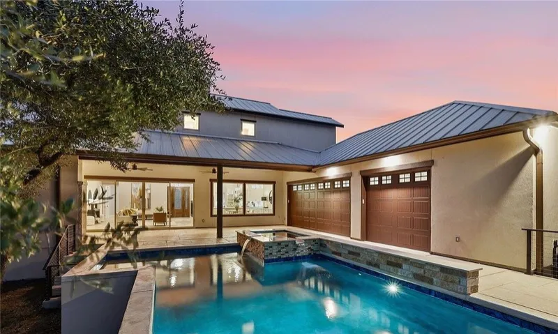Hill Country home with pool at dusk, 1426 Robusto in Vintage Oaks