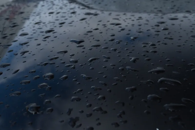 Water beading on freshly protected black paint